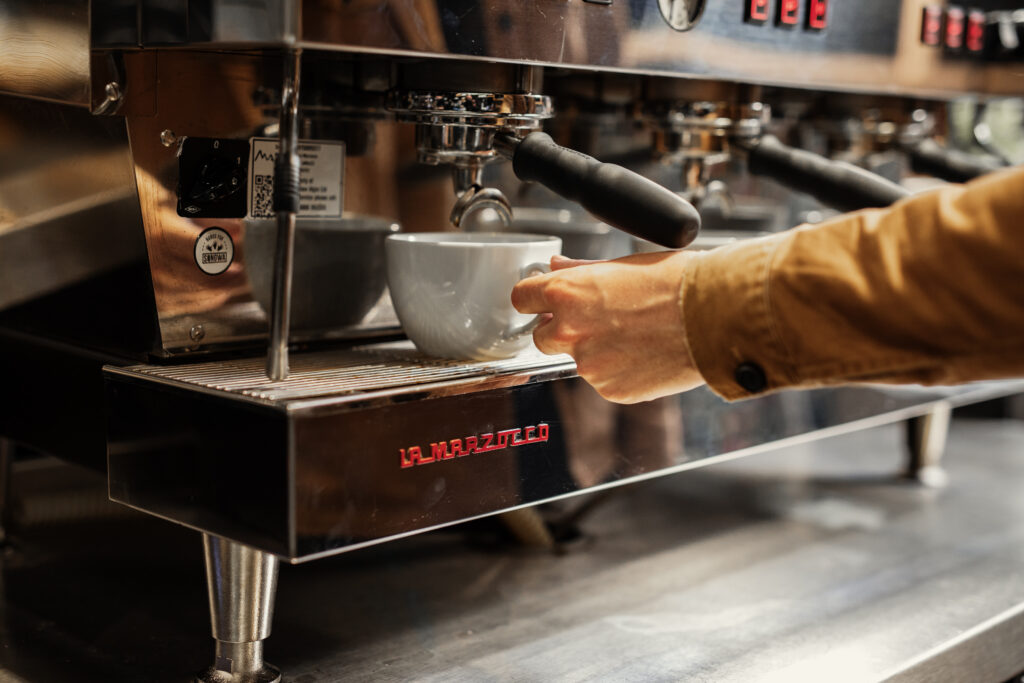 Barista pouring an espresso on the La Marzocco espresso machine