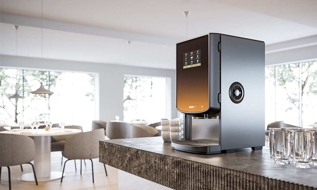 Instant hot drinks machine with touch screen controls on a buffet counter in a hotel