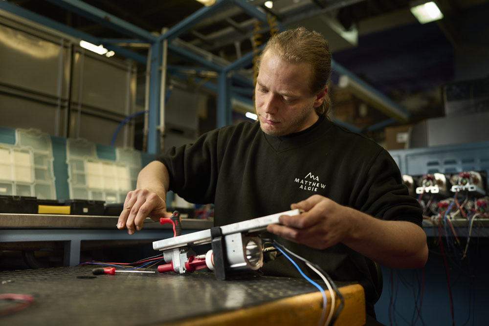 Matthew Algie engineer fixing machine